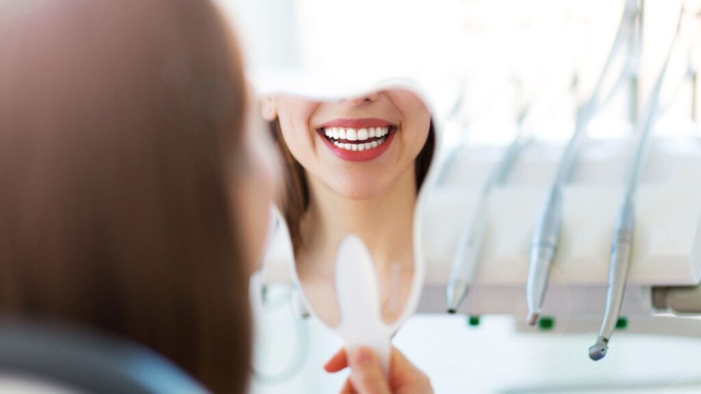 woman smiling in mirror